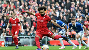 Salah double downs 10-man Everton, sends Liverpool top
