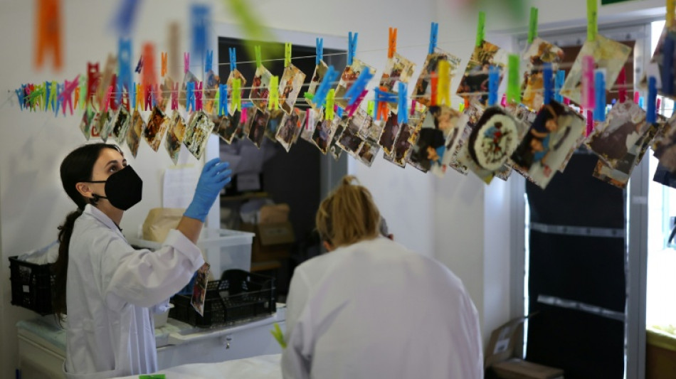 After deadly floods, Spaniards fight to save photos