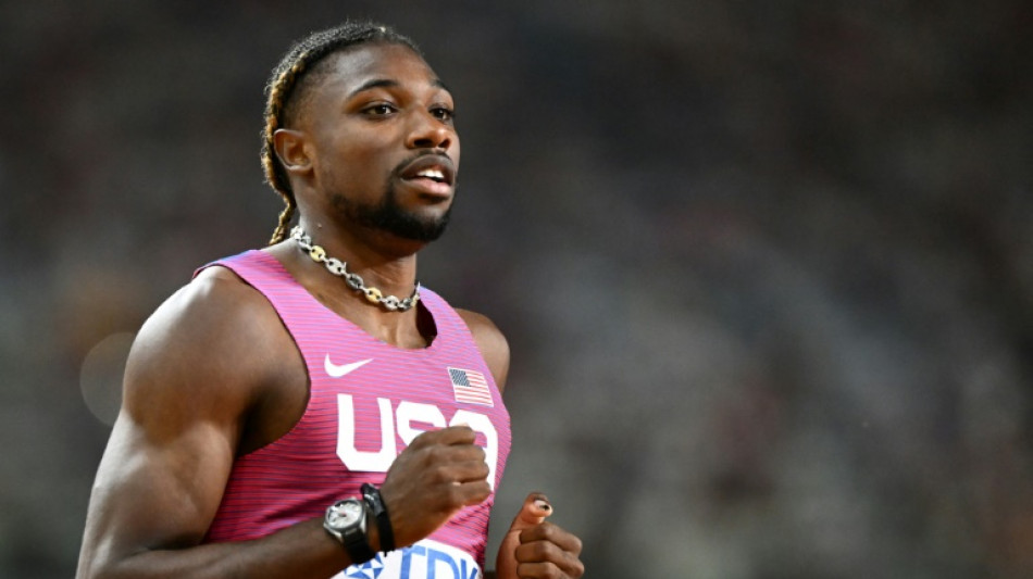 Lyles into final of world 200m despite golf buggy collision