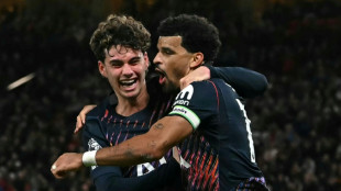 10-man Tottenham strike back to hold Man Utd 