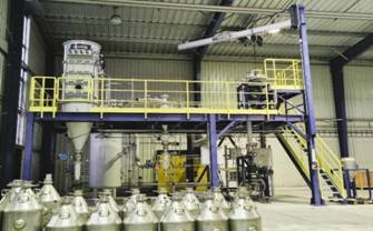 A factory with several metal containers AI-generated content may be incorrect.