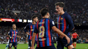 Nervy Barca cling on to beat Celta and top La Liga