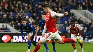 Arsenal stay top despite Man City win, Liverpool beat nine-man Spurs