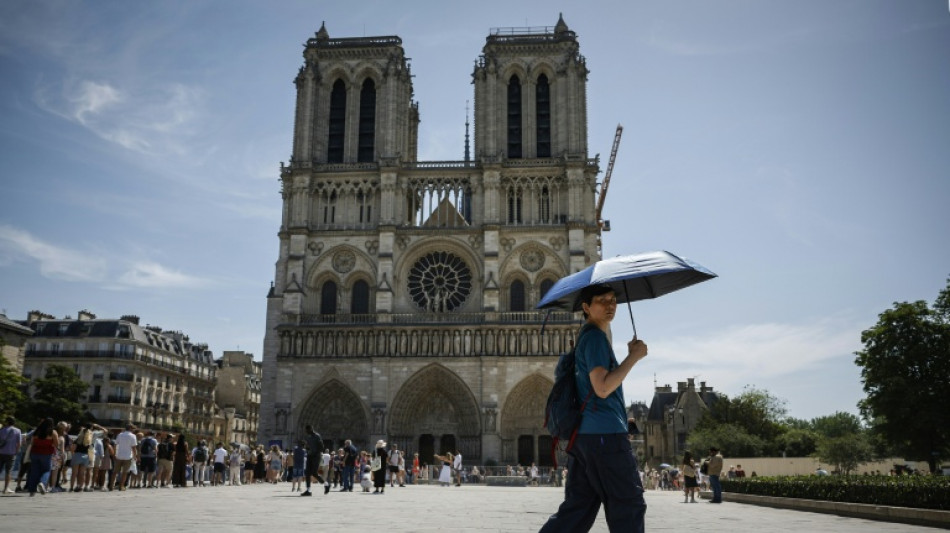 France warns that strong storms could end deadly heatwave