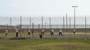 Color-coded migrants wait for answers in Texas heat